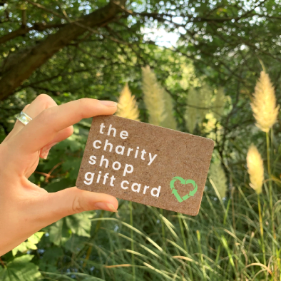 The Charity Shop Gift Card with green forest background